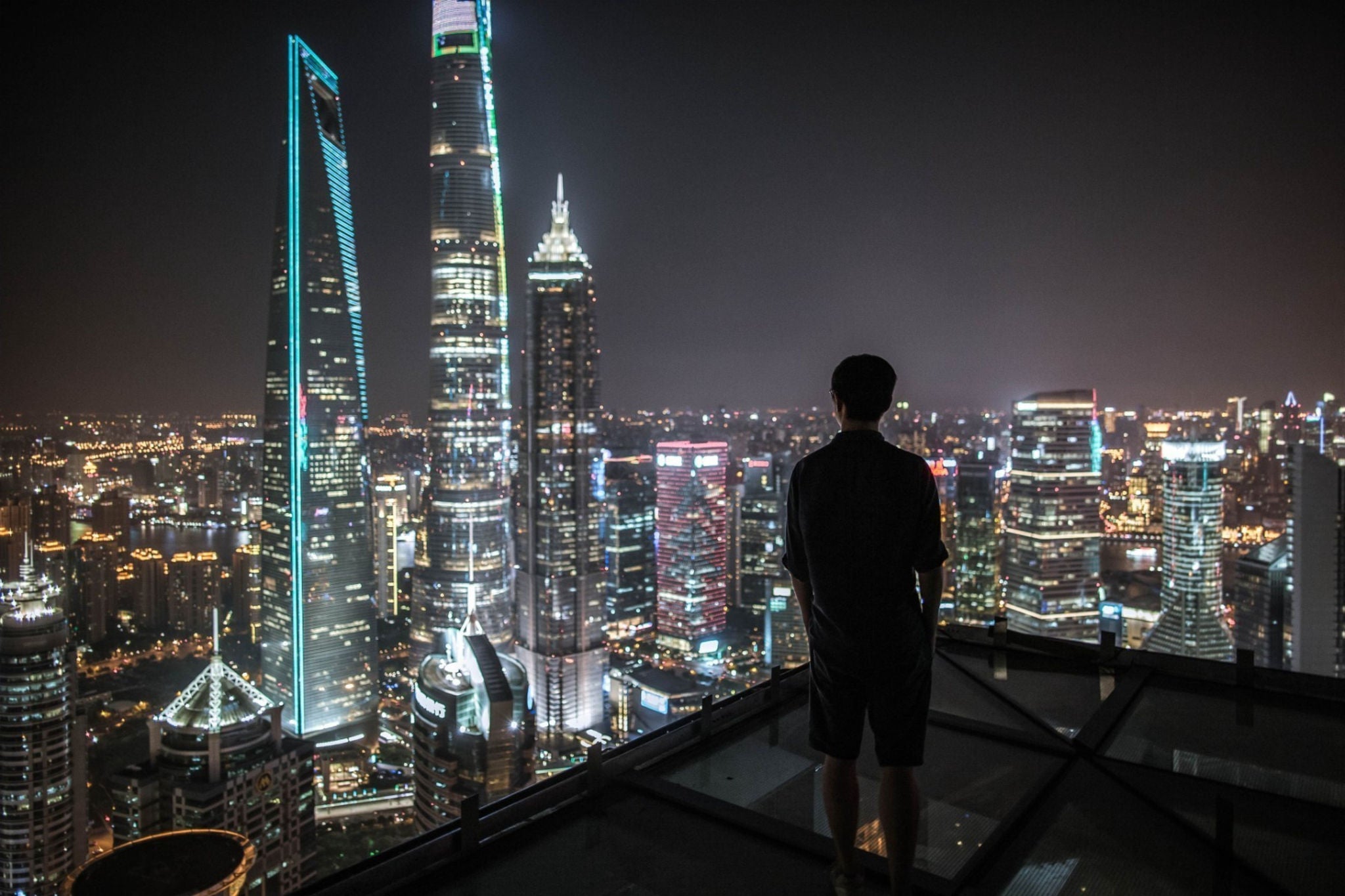 man admiring the skyscrapers
